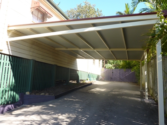Flat carport attached to house.