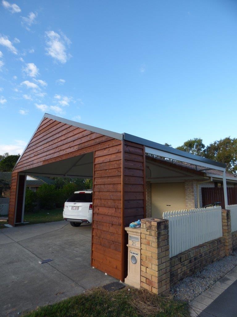 Timber carport with gable roof design.