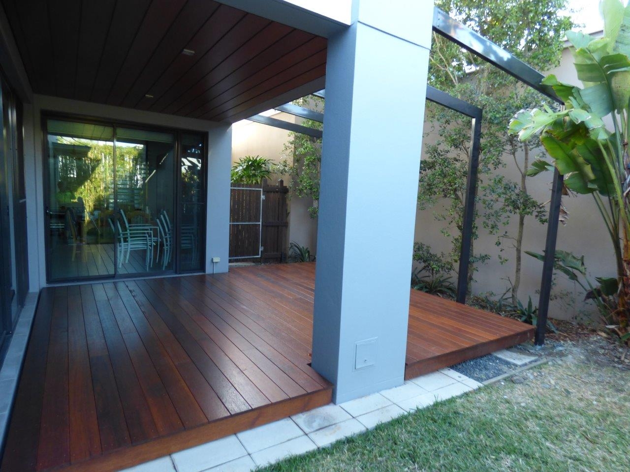 Patio and deck with rendered columns.