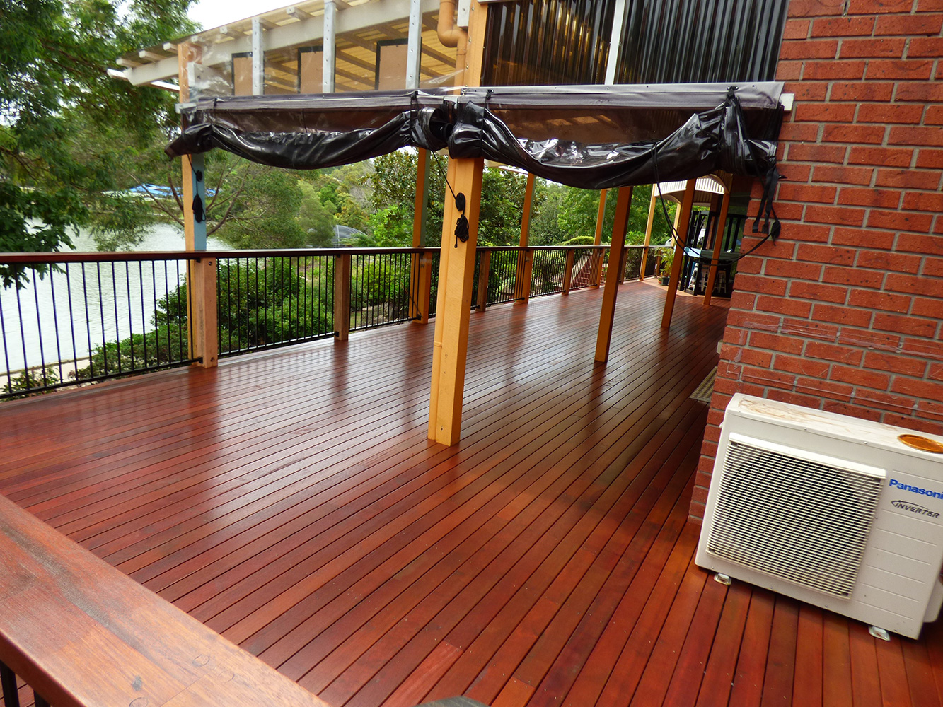 Commercial Property - Café and Real estate Agents in Forest Lake, Brisbane. Building overlooks the lake. Re-build in Kwila decking. Kwila hand rail with powder coated aluminium balustrade. #premiumlifestyles #commercialdecks