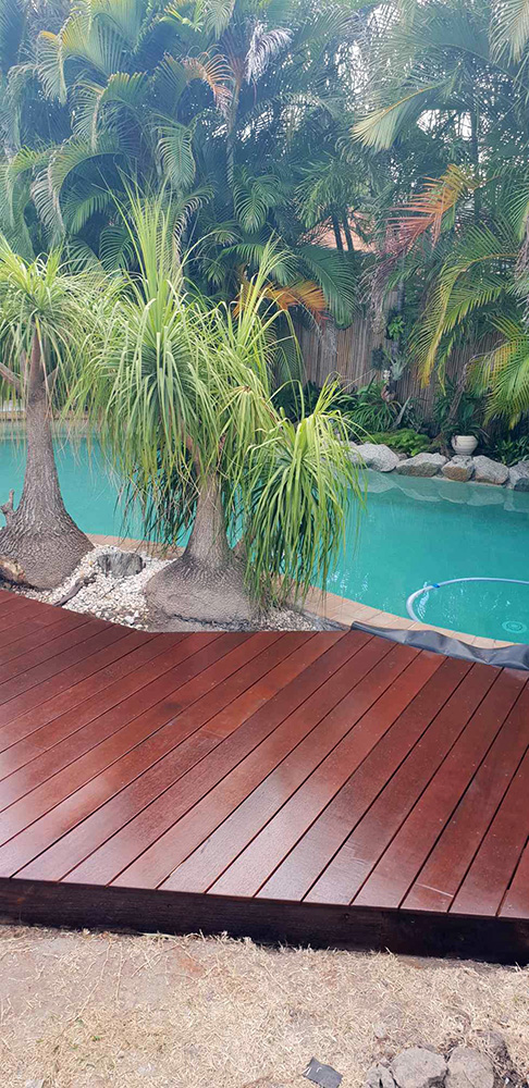 Ground level deck around a pool. Hoist protection and 3 coats of a breathable sealant for protection from the sun and pool chemicals.