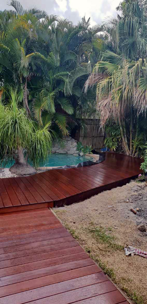Ground level deck around a pool. Hoist protection and 3 coats of a breathable sealant for protection from the sun and pool chemicals.