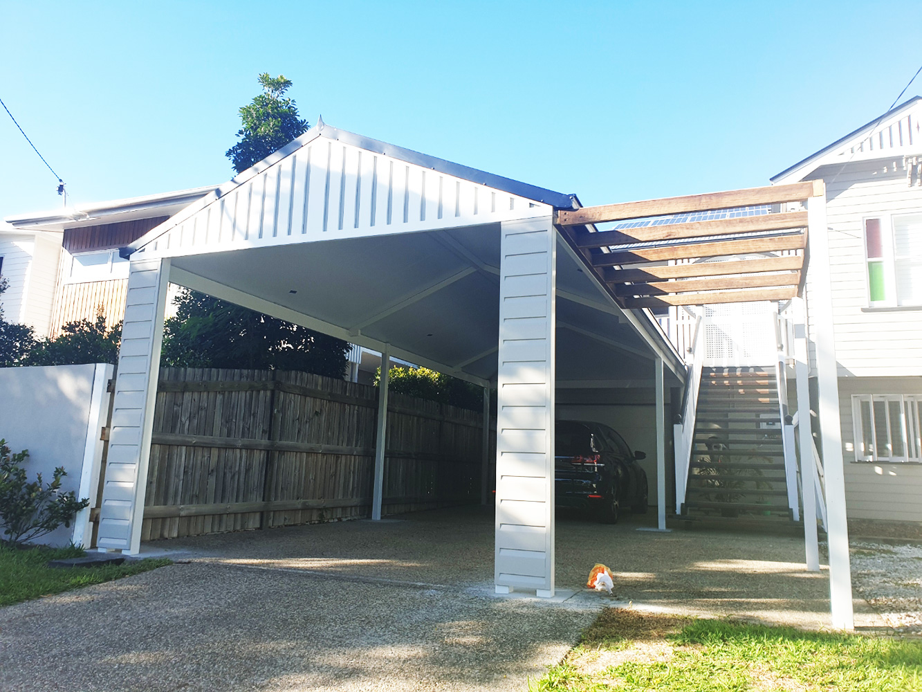 Gable pitched carport. Fully welded and Dulux powder coated. All-Gal trusses and beams. Weather board cladding and a fibre cement sheet with decorative cover strips to create an appealing facade. This structure is complete with a hardwood planter trellis.